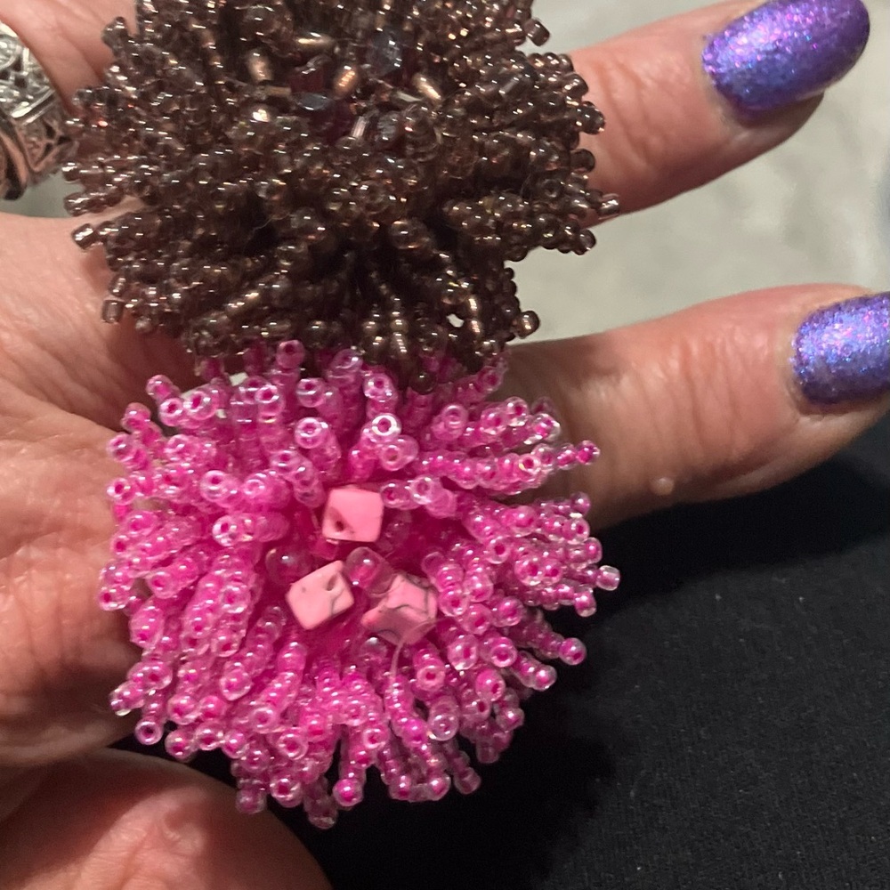 Two massive beaded glass flower shaped adjustable rings vintage